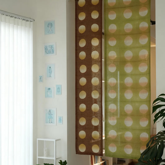 alternate angle of Polka Dot Linen Noren — Orange / Yellow hanging as a two-panel doorway curtain