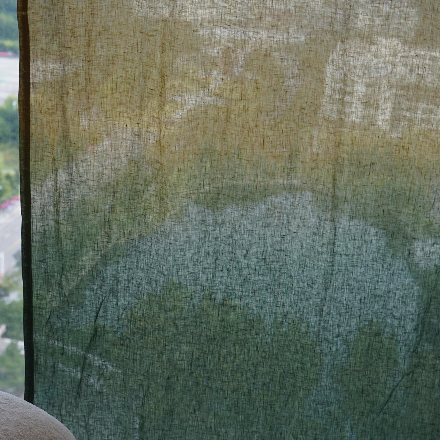 Linen Panel — Deep Teal hanging by a window, filtering daylight in a styled interior