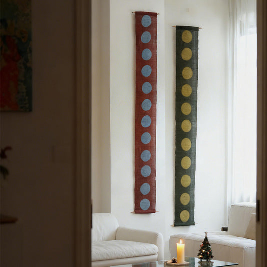 Narrow Ramie — Circles displayed vertically on a wall as a decorative textile banner