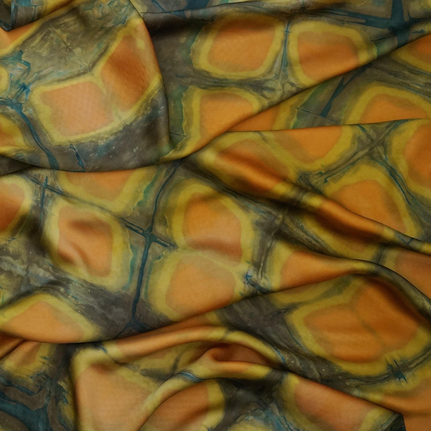 Scarf — Amber Green styled and worn, showing the natural plant-dyed pattern