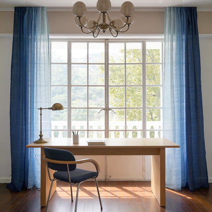 Linen Panel — Soft Blue hanging by a window, filtering daylight in a styled interior
