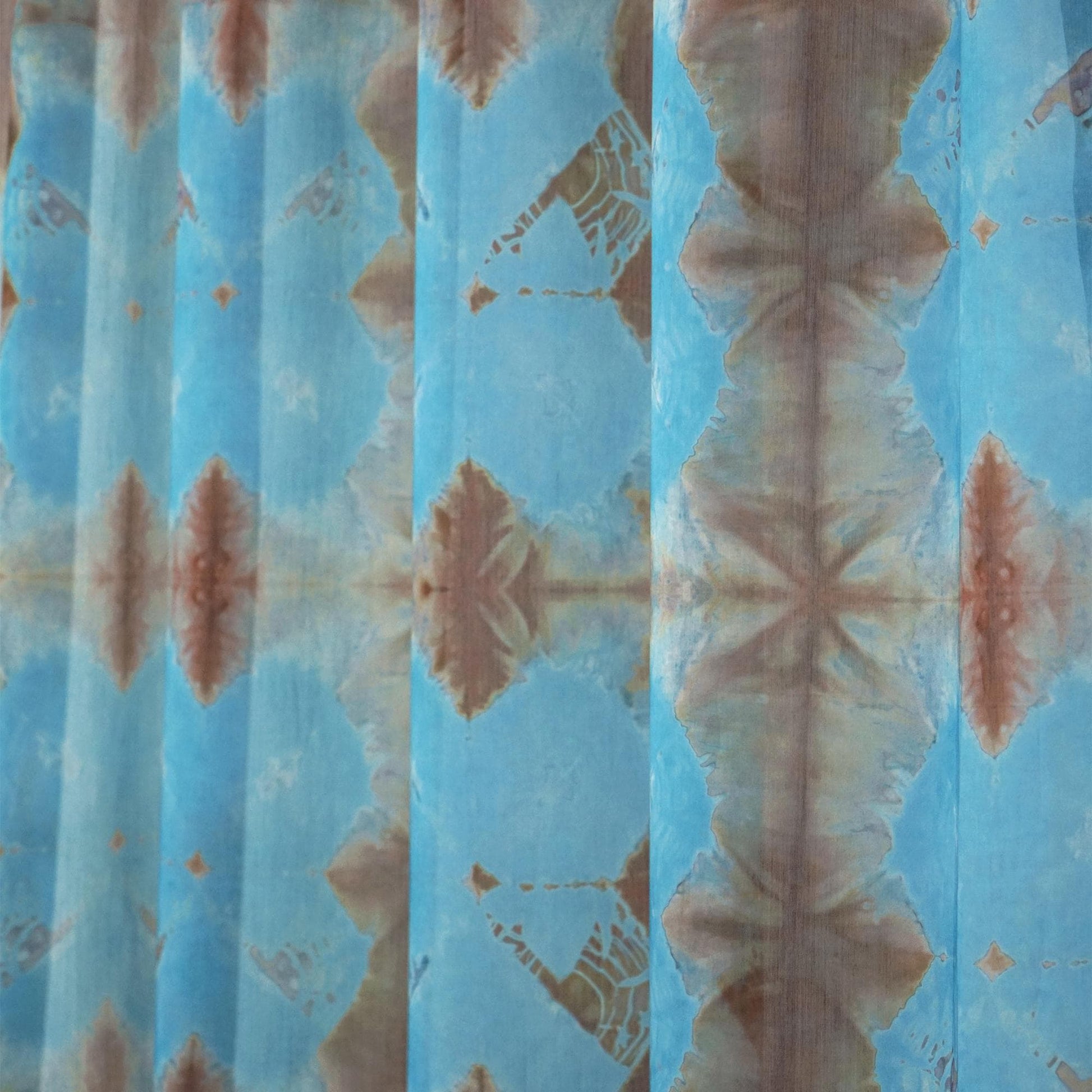 lifestyle scene with Pattern Drapery — Red Blue creating a soft, airy room partition