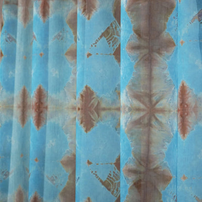 lifestyle scene with Pattern Drapery — Red Blue creating a soft, airy room partition