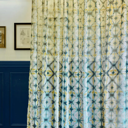detail view of Pattern Drapery — Moss Yellow showing plant-dyed pattern and sheer drape