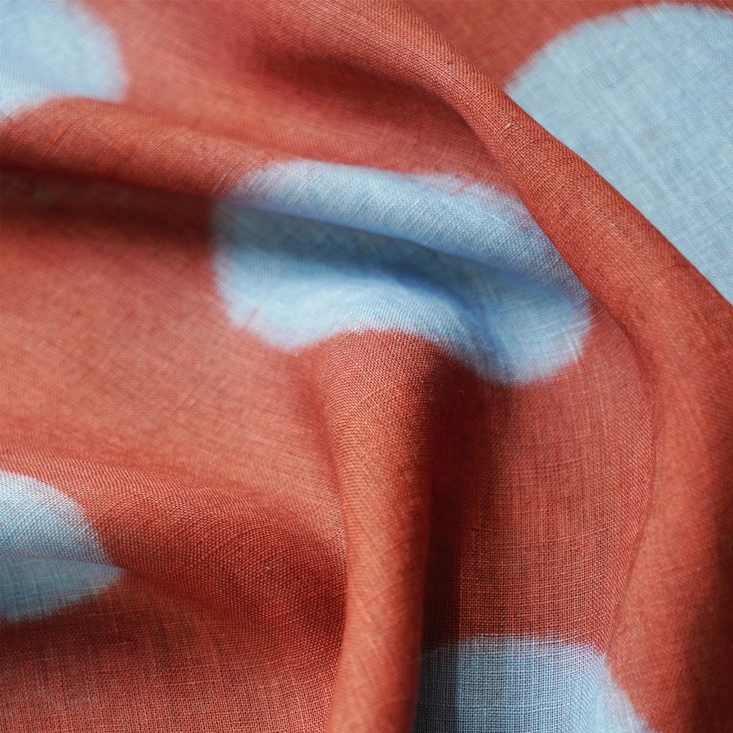 close-up of Polka Dot Linen Noren — Brick / Red showing the natural resist-dye motif on linen