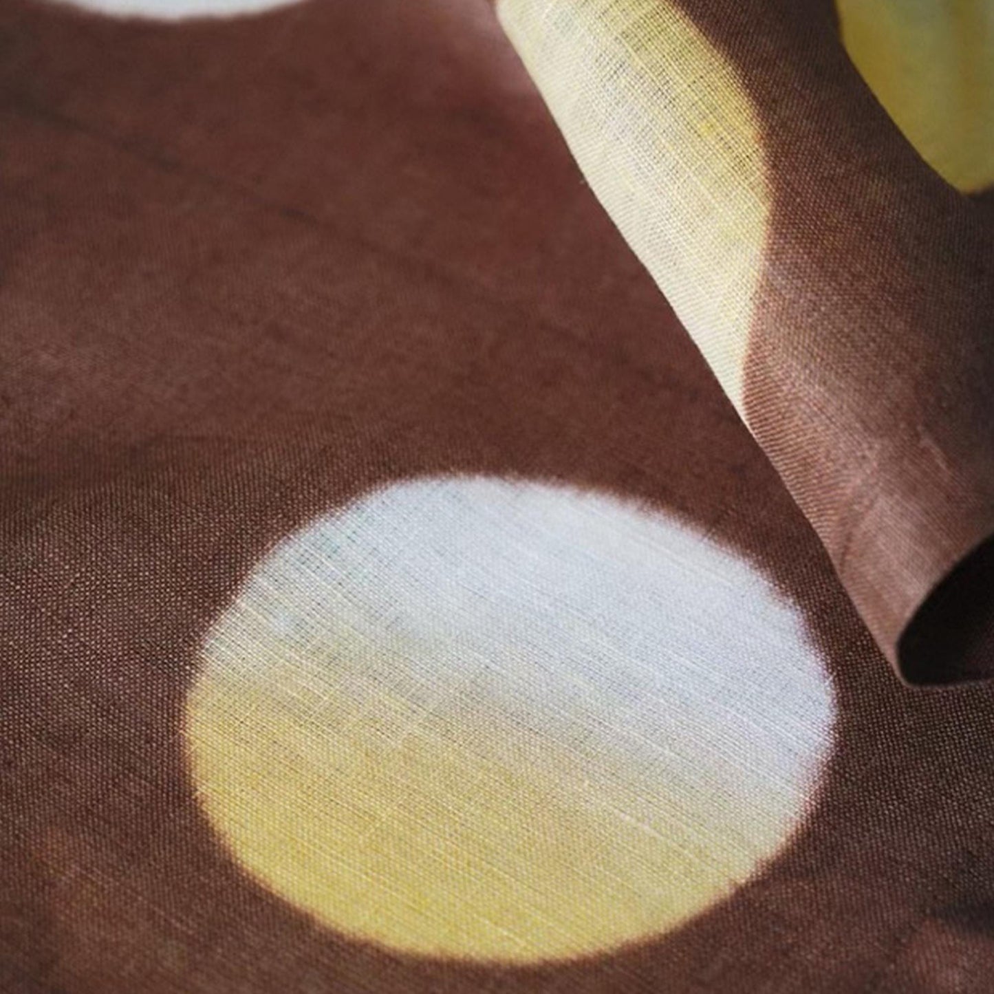 close-up of Polka Dot Linen Noren — Ochre / Brown showing the natural resist-dye motif on linen