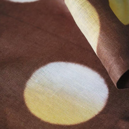 close-up of Polka Dot Linen Noren — Ochre / Brown showing the natural resist-dye motif on linen