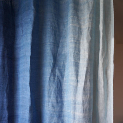 room scene with Linen Panel — Soft Blue used as sheer curtains in a living space