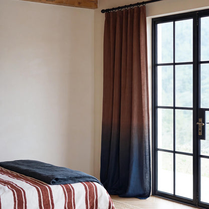 Linen Panel — Crimson Blue hanging by a window, filtering daylight in a styled interior