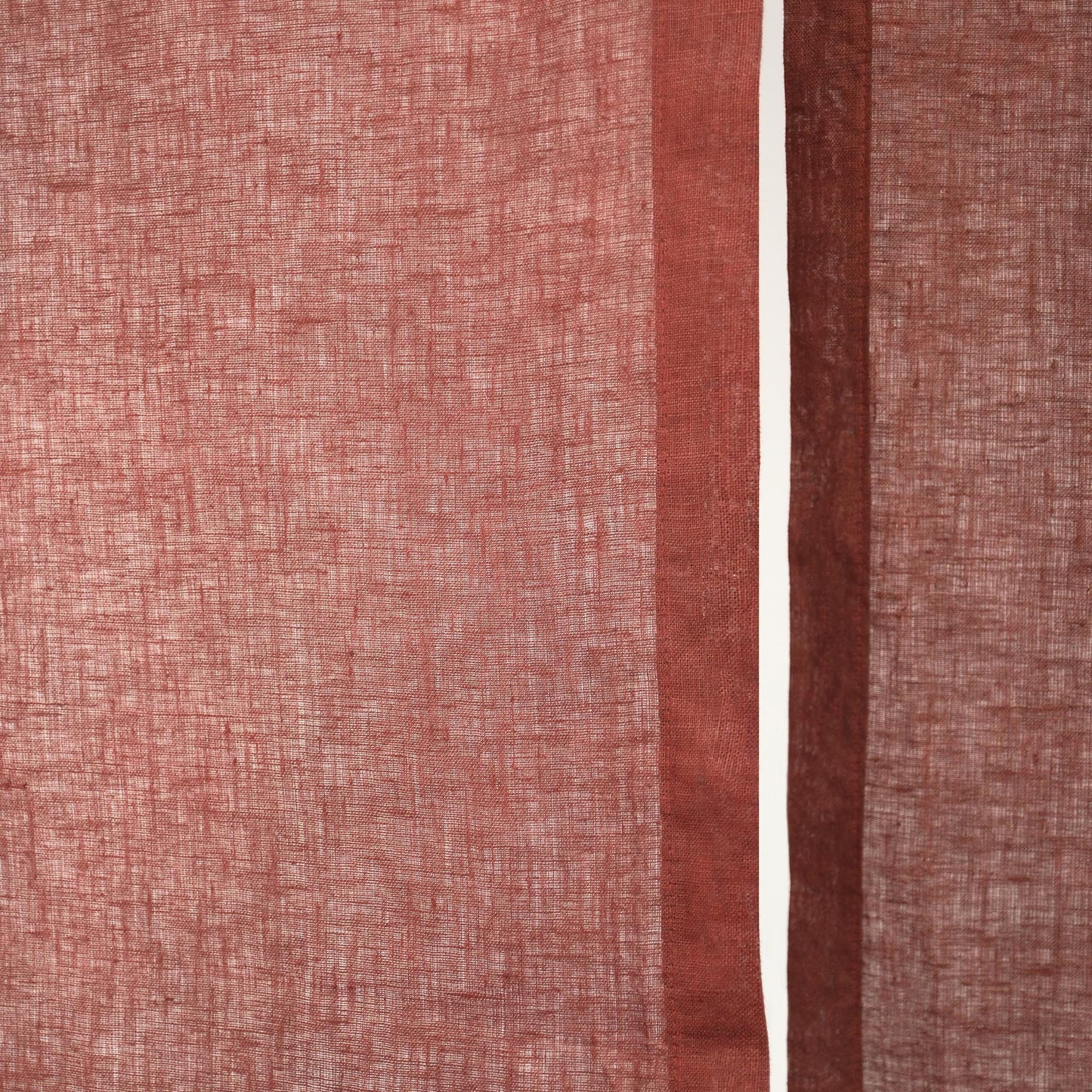alternate angle of Soft Tone Noren — Dusty Rose hanging as a two-panel doorway curtain