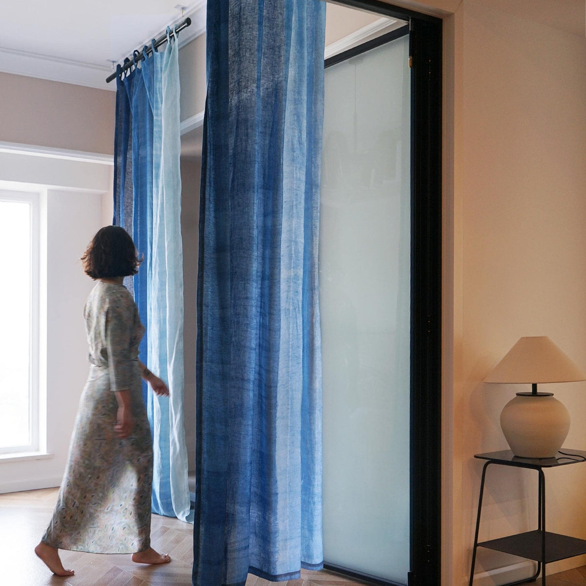 Linen Panel — Soft Blue hanging by a window, filtering daylight in a styled interior