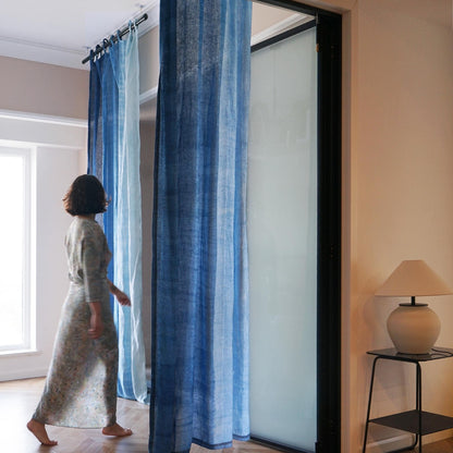Linen Panel — Soft Blue hanging by a window, filtering daylight in a styled interior