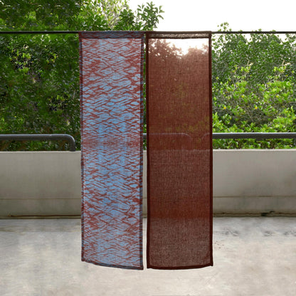 alternate angle of Motif Linen Noren — Mist Red hanging as a two-panel doorway curtain