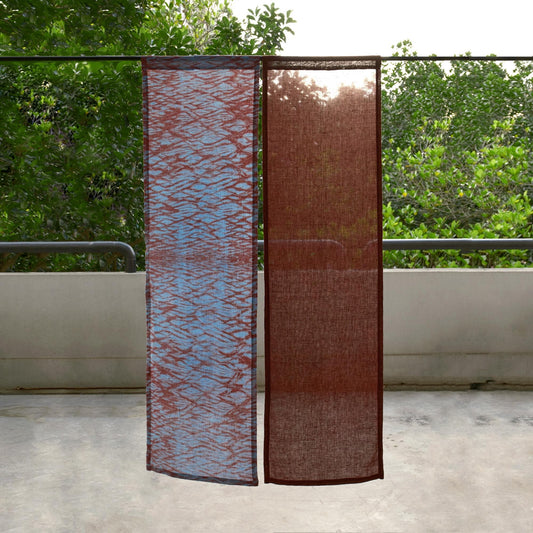 alternate angle of Motif Linen Noren — Mist Red hanging as a two-panel doorway curtain