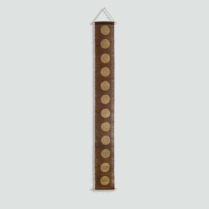 Narrow Ramie — Circles displayed vertically on a wall as a decorative textile banner