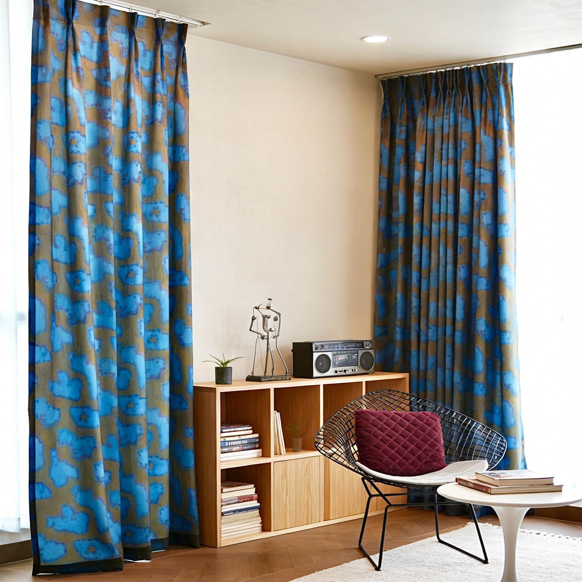 Pattern Drapery — Deep Blue dressing tall windows in a styled living room