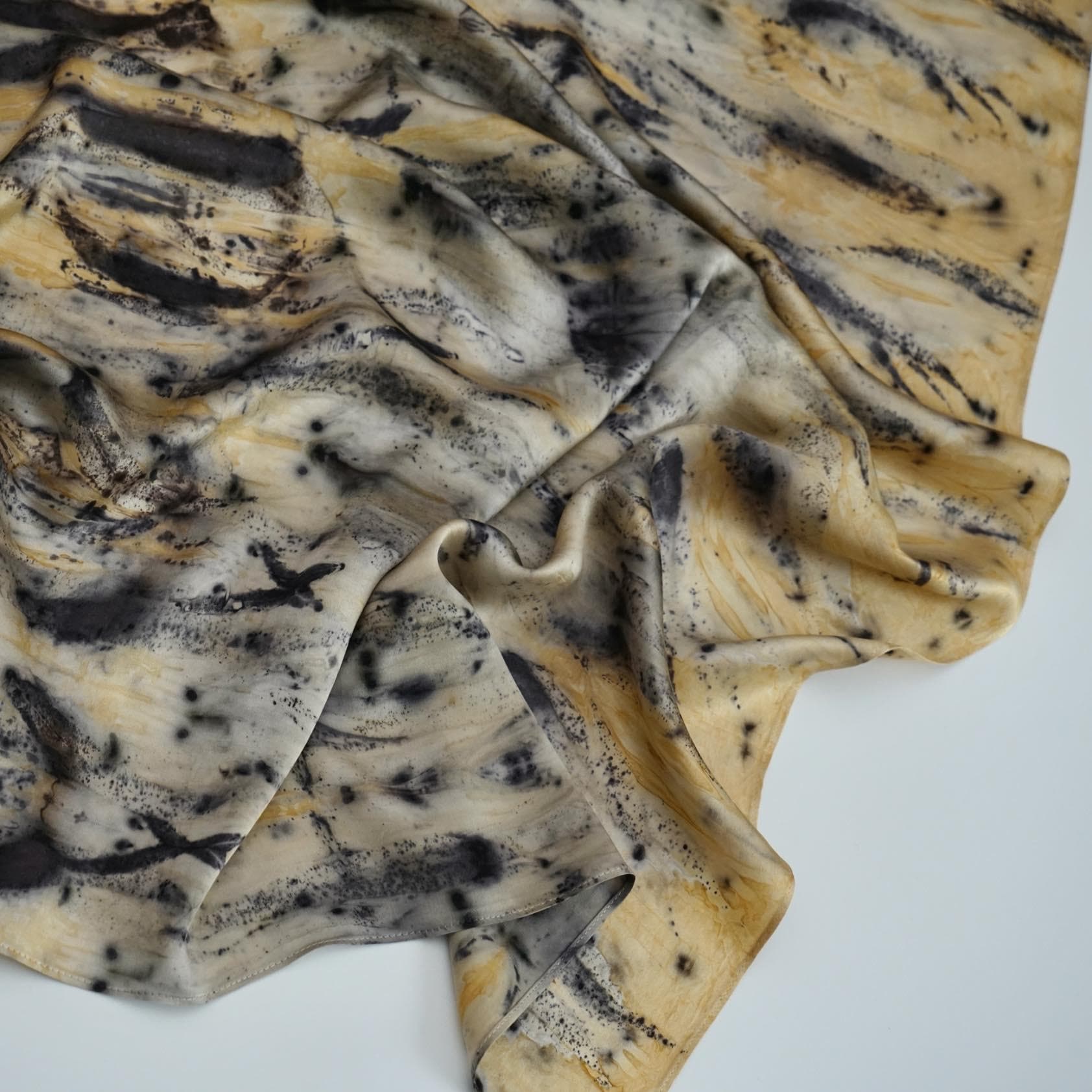 close-up of Scarf — Ochre Vine showing the soft weave and botanical color
