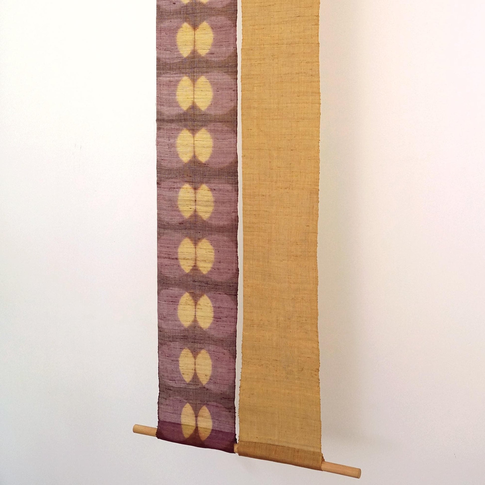 Narrow Ramie — Bean Motif displayed vertically on a wall as a decorative textile banner