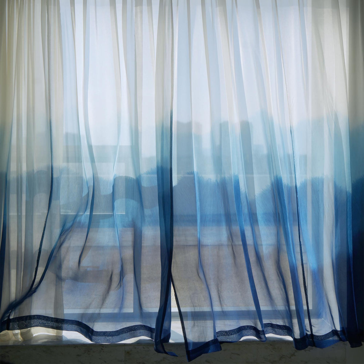 Sheer Curtain — White Blue shown in a bedroom or living room setting