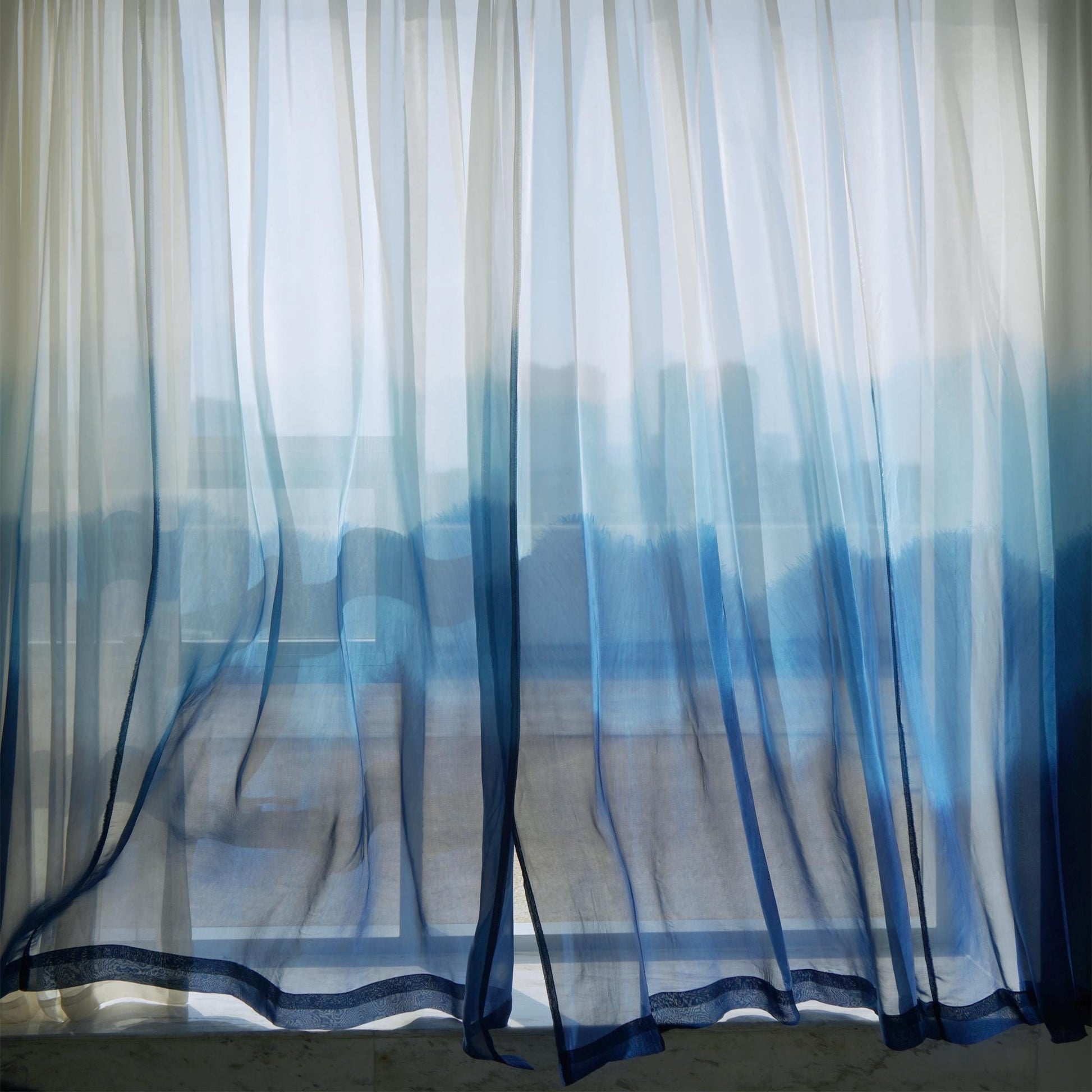 Sheer Curtain — White Blue shown in a bedroom or living room setting