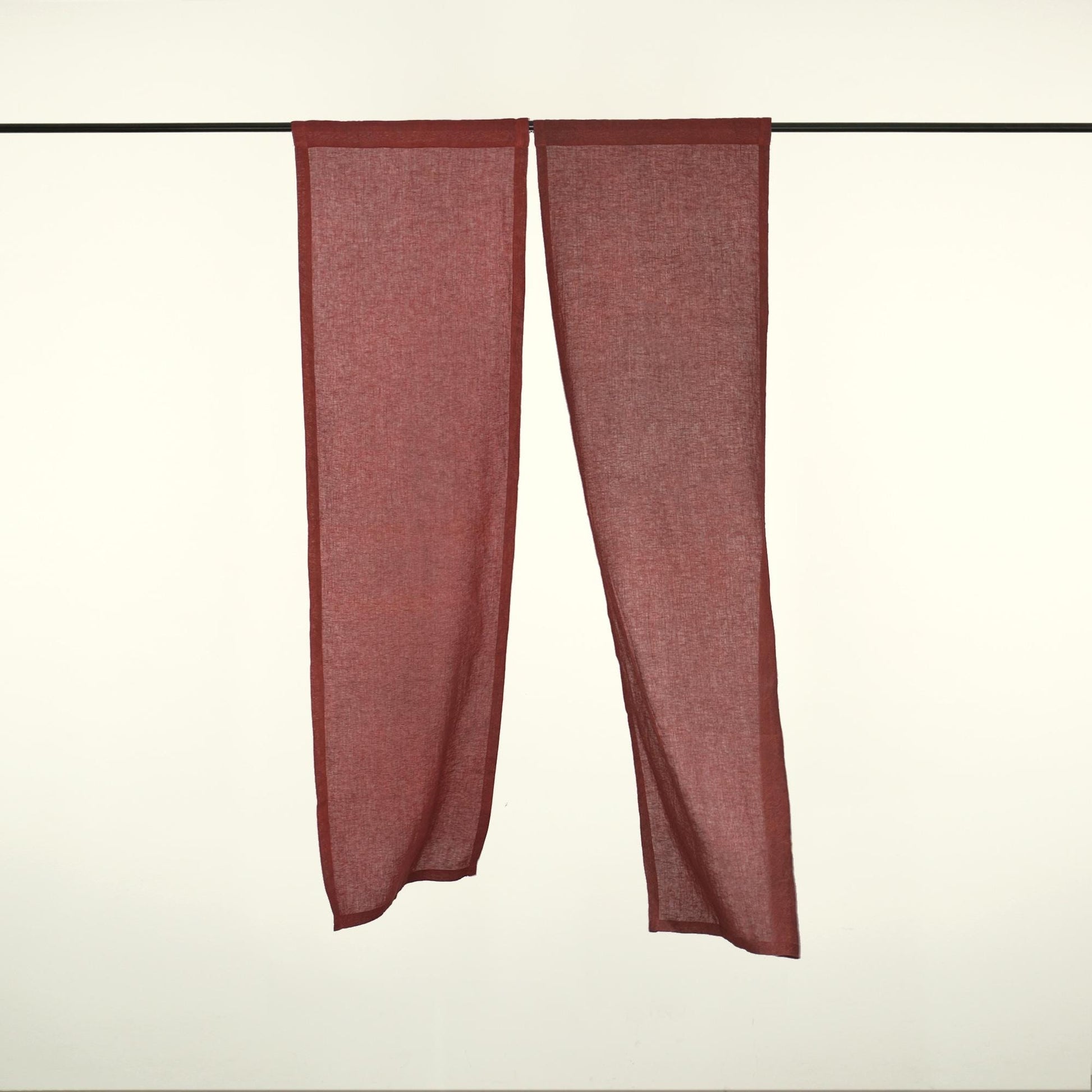 alternate angle of Soft Tone Noren — Dusty Rose hanging as a two-panel doorway curtain