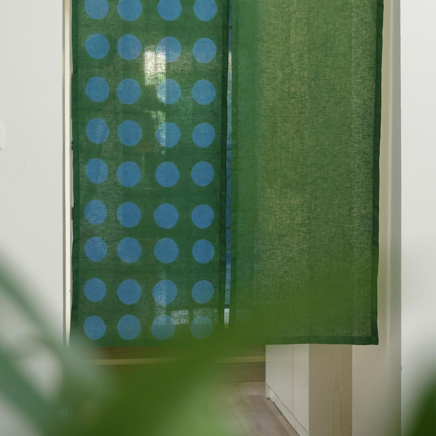 close-up of Polka Dot Linen Noren — Green / Dots showing the natural resist-dye motif on linen