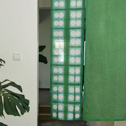 close-up of Motif Linen Noren — Soft Moss showing the natural resist-dye motif on linen