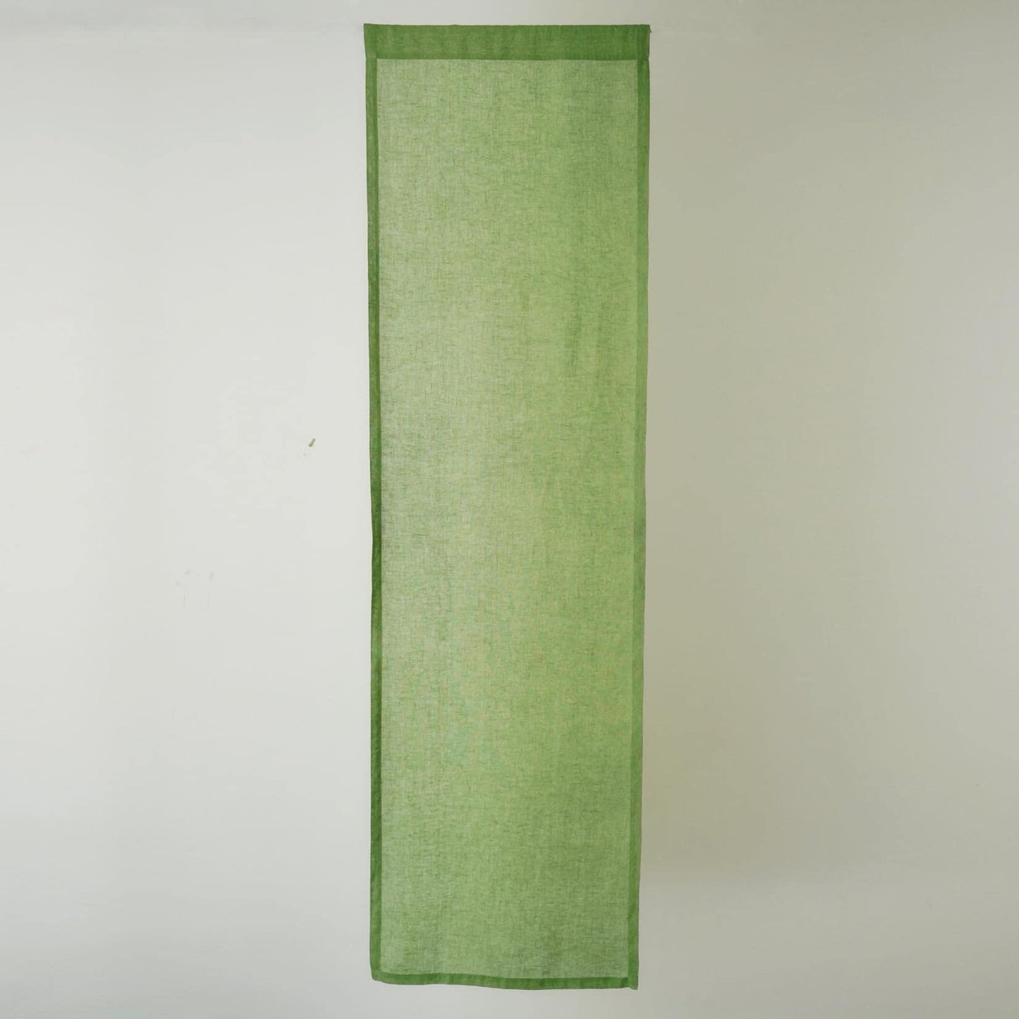 detail view of Soft Tone Noren — Leaf Green showing plant-dyed linen texture and pattern