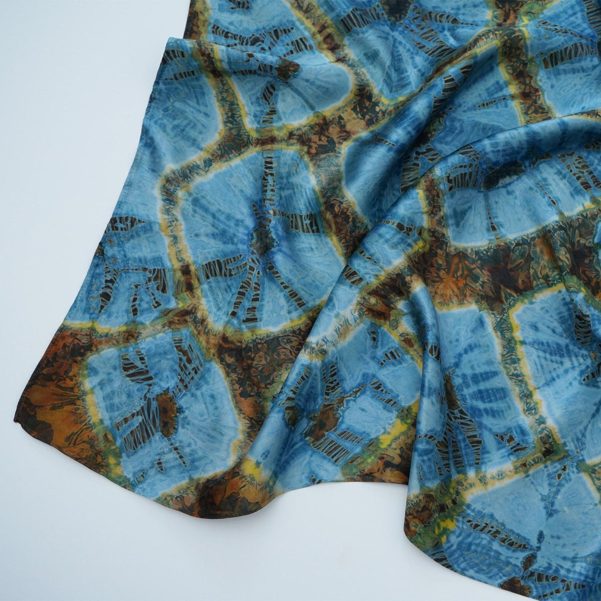 flat-lay view of Scarf — Aqua Bloom highlighting the natural dye and motif