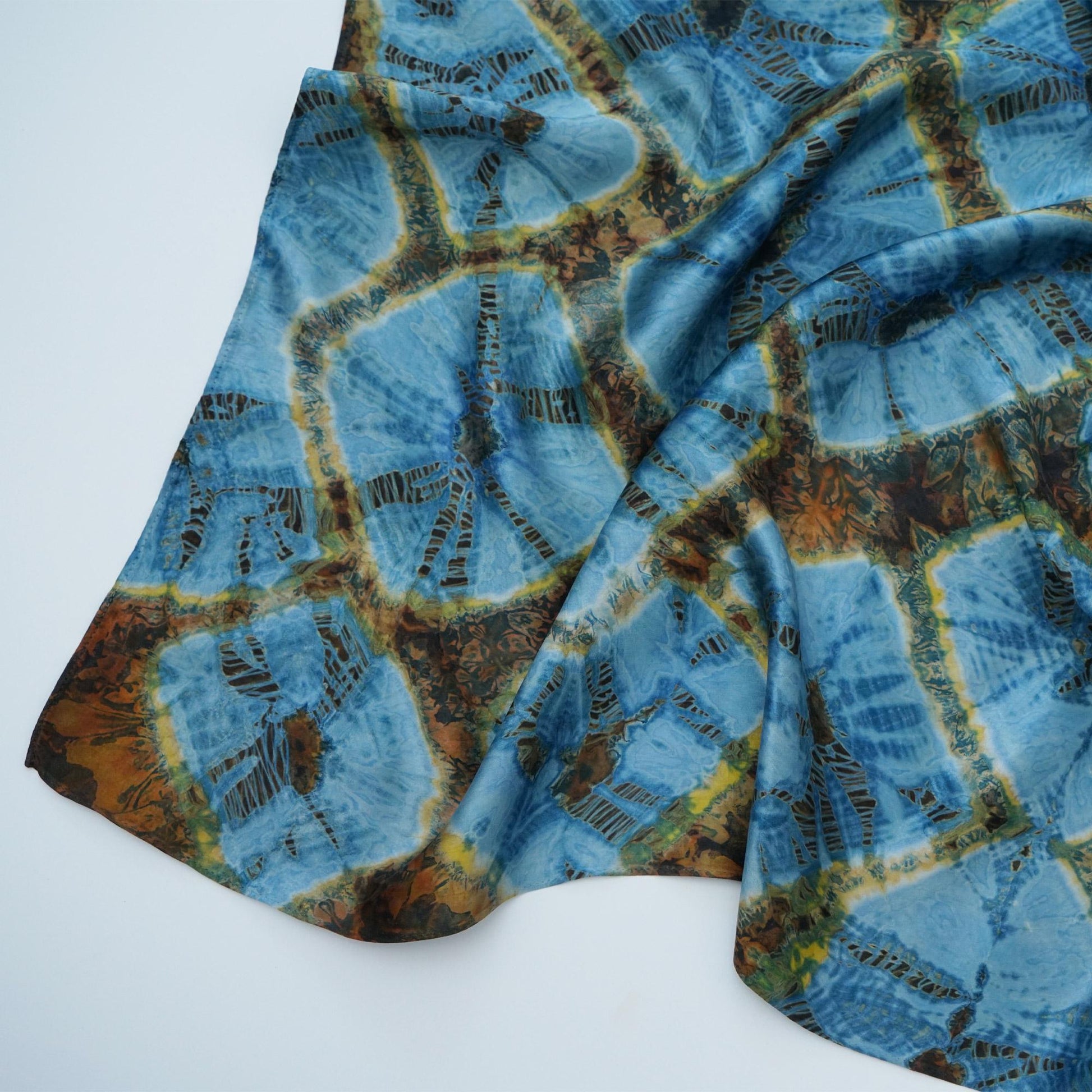 flat-lay view of Scarf — Aqua Bloom highlighting the natural dye and motif