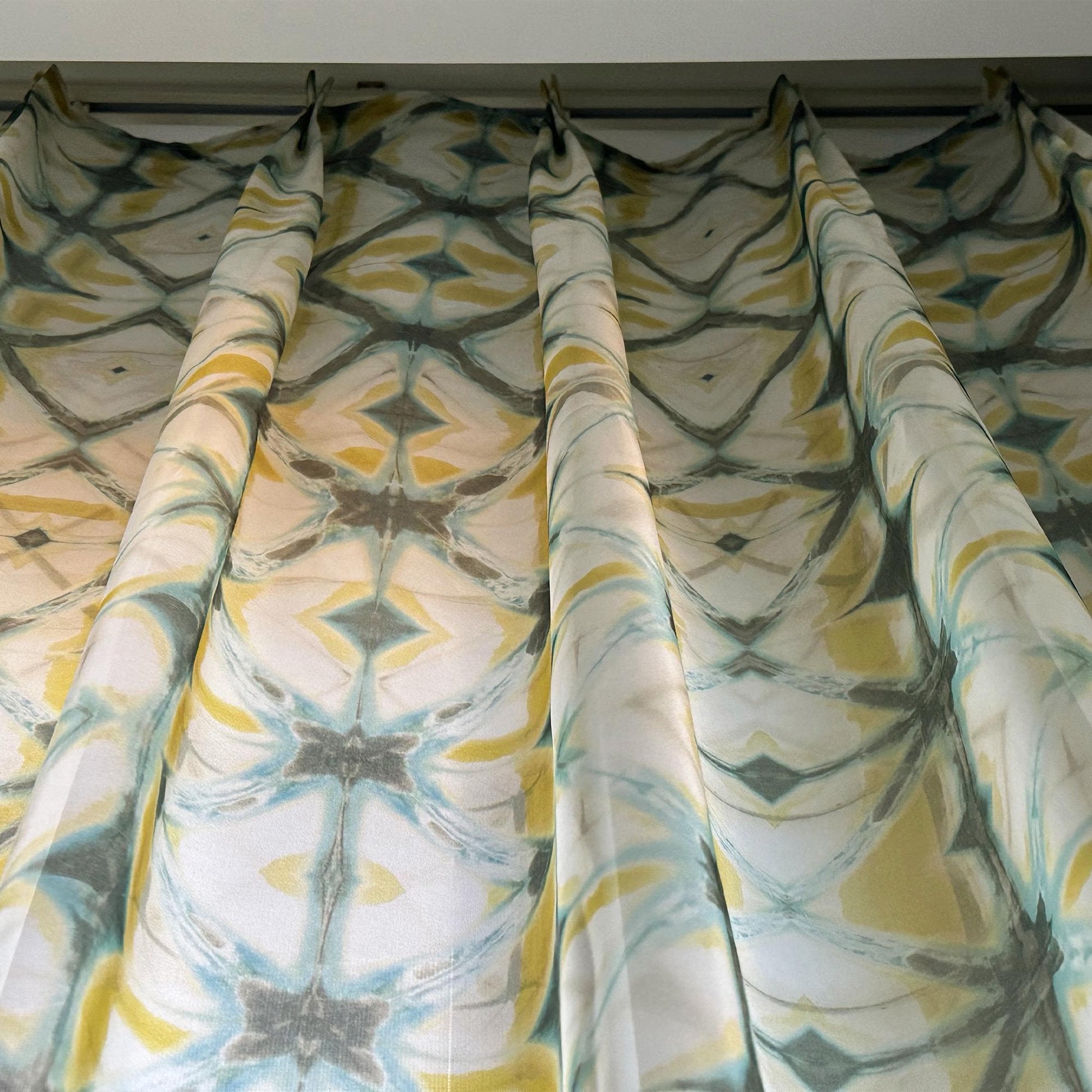 lifestyle scene with Pattern Drapery — Moss Yellow creating a soft, airy room partition