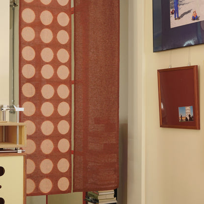 Hand dyed linen noren curtain in pink and red, close-up of the plant-dyed pattern