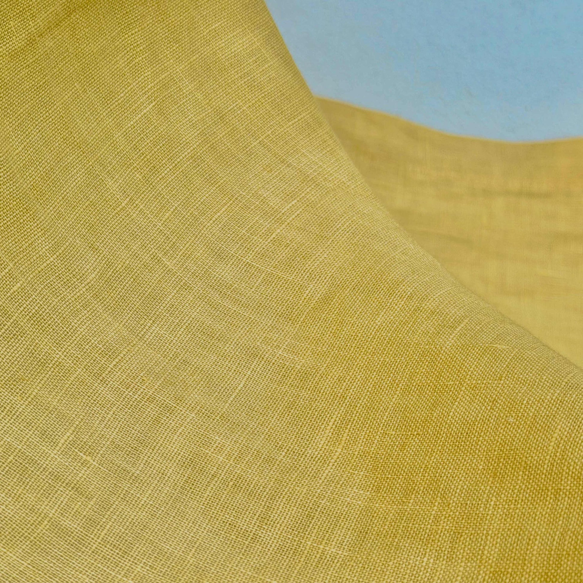 detail view of Linen Panel — Citron Yellow showing plant-dyed fabric texture and pattern