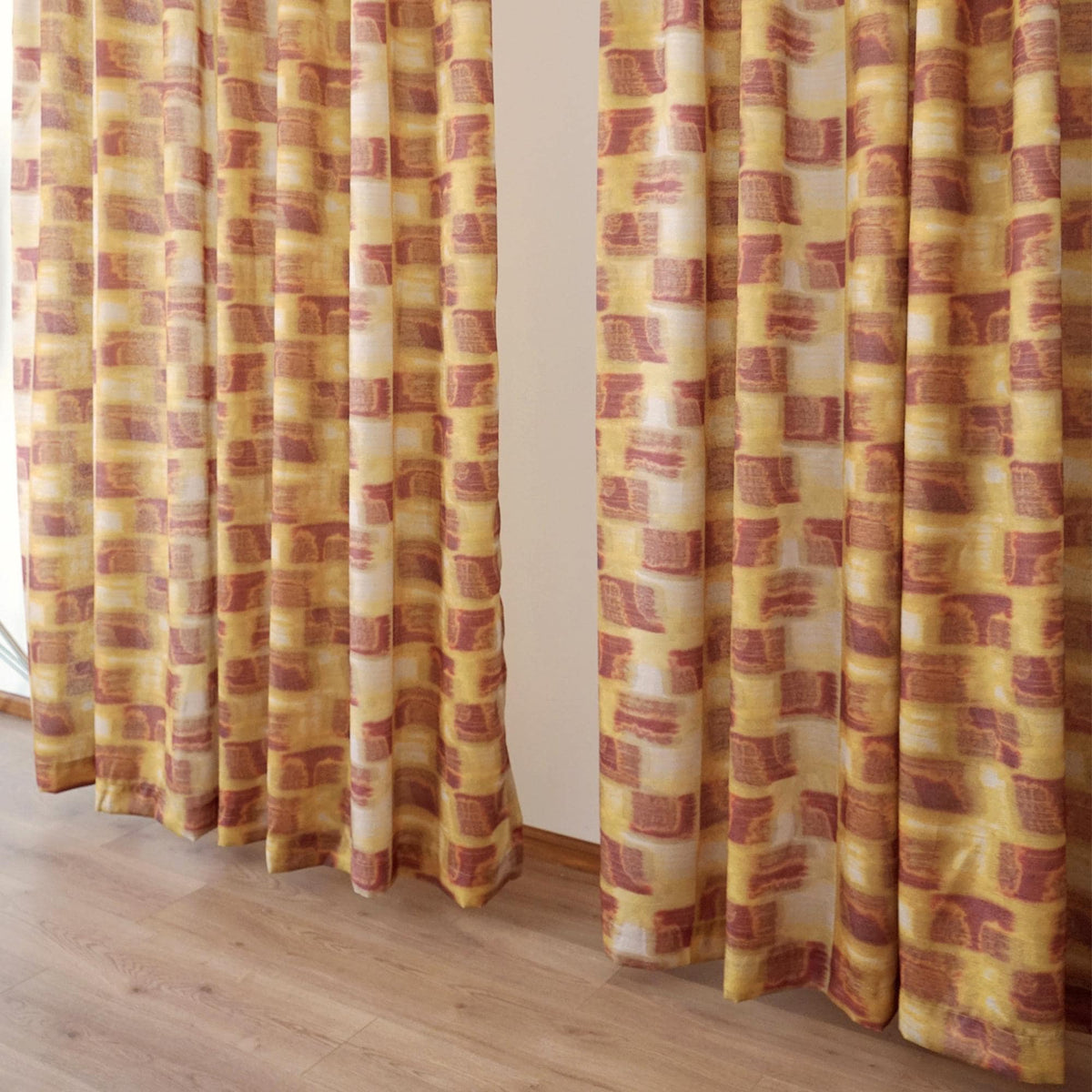 lifestyle scene with Pattern Drapery — Golden Ochre creating a soft, airy room partition