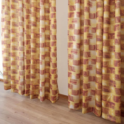 lifestyle scene with Pattern Drapery — Golden Ochre creating a soft, airy room partition