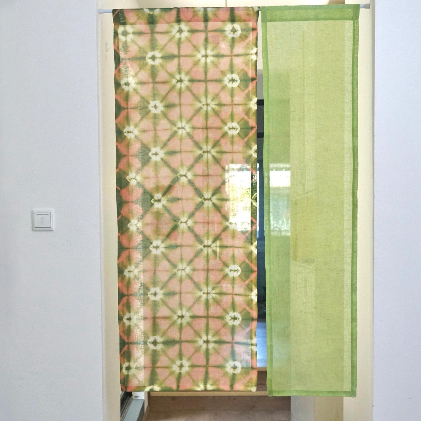 detail view of Motif Linen Noren — Peach showing plant-dyed linen texture and pattern