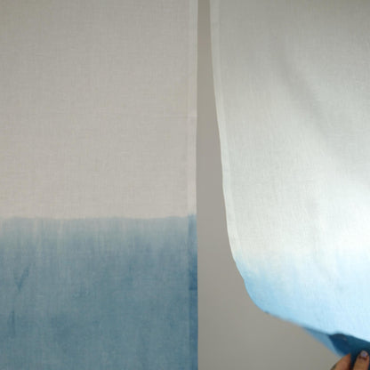 alternate angle of Soft Tone Noren — Mist Blue hanging as a two-panel doorway curtain