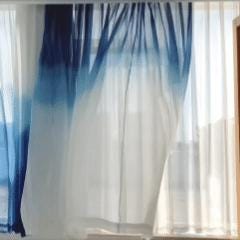 Sheer Curtain — Indigo Flow shown in a bedroom or living room setting