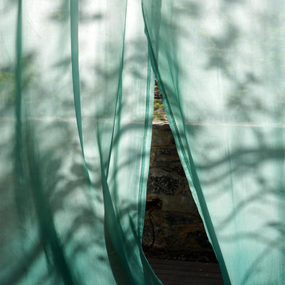 alternate interior view with Sheer Curtain — Emerald Blue filtering soft daylight