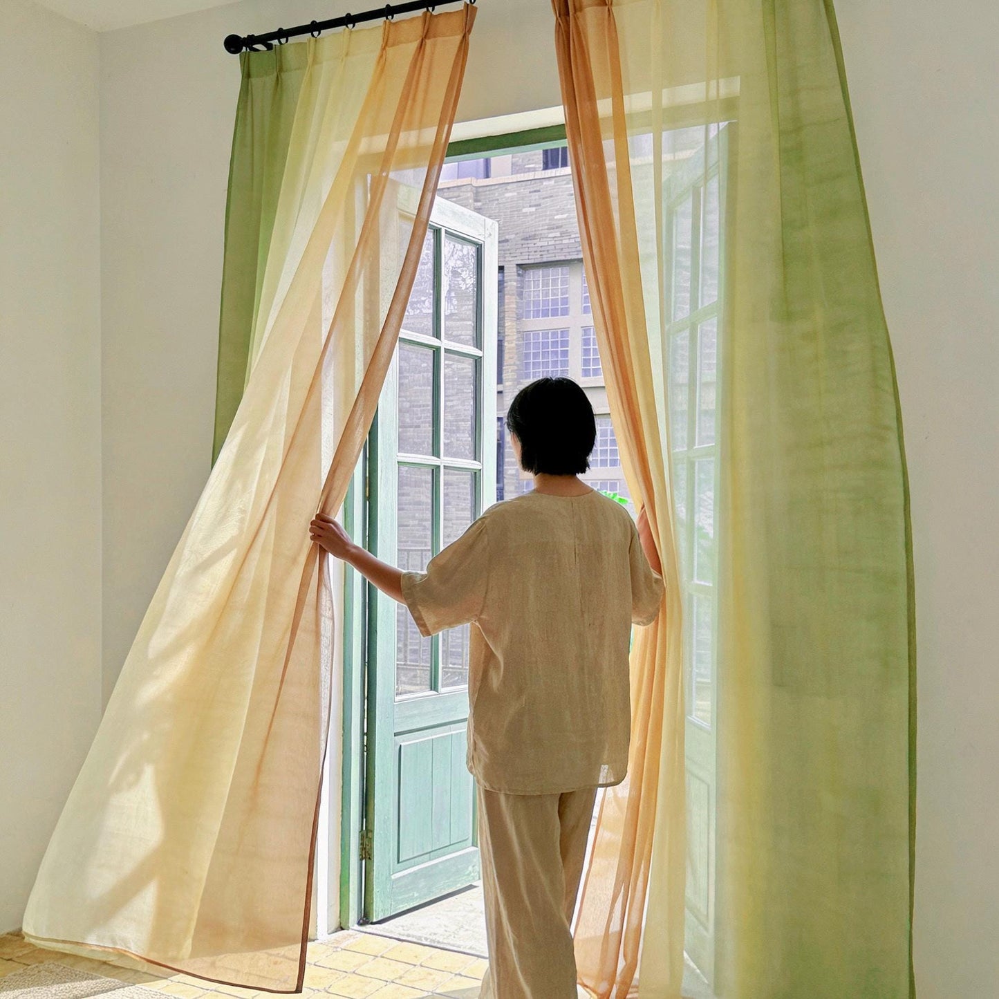 Sheer Curtain — Orange Green shown in a bedroom or living room setting