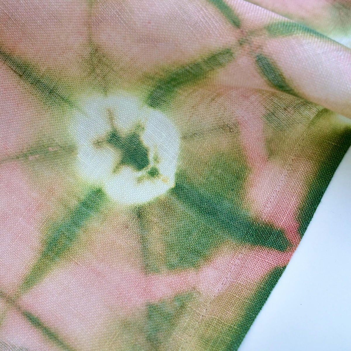 alternate angle of Motif Linen Noren — Peach hanging as a two-panel doorway curtain