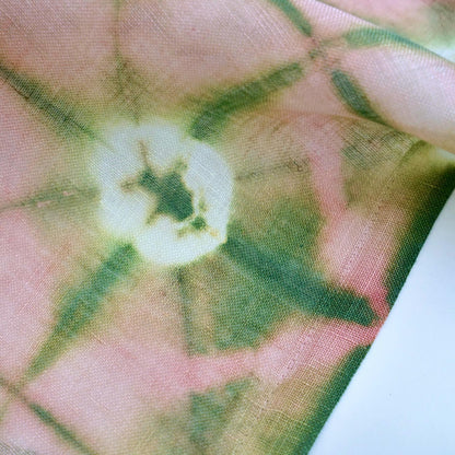 alternate angle of Motif Linen Noren — Peach hanging as a two-panel doorway curtain