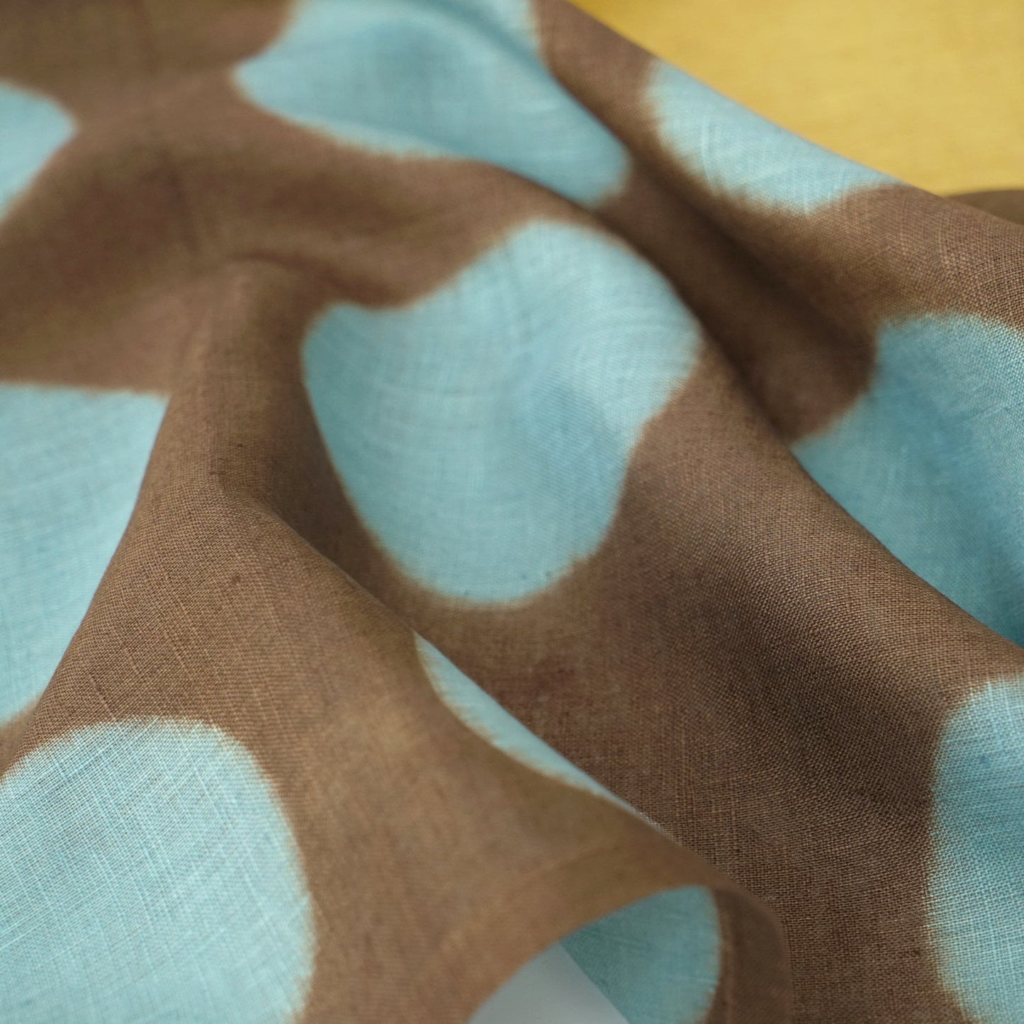 Hand dyed linen noren curtain in yellow and coffee, lifestyle view in a home interior