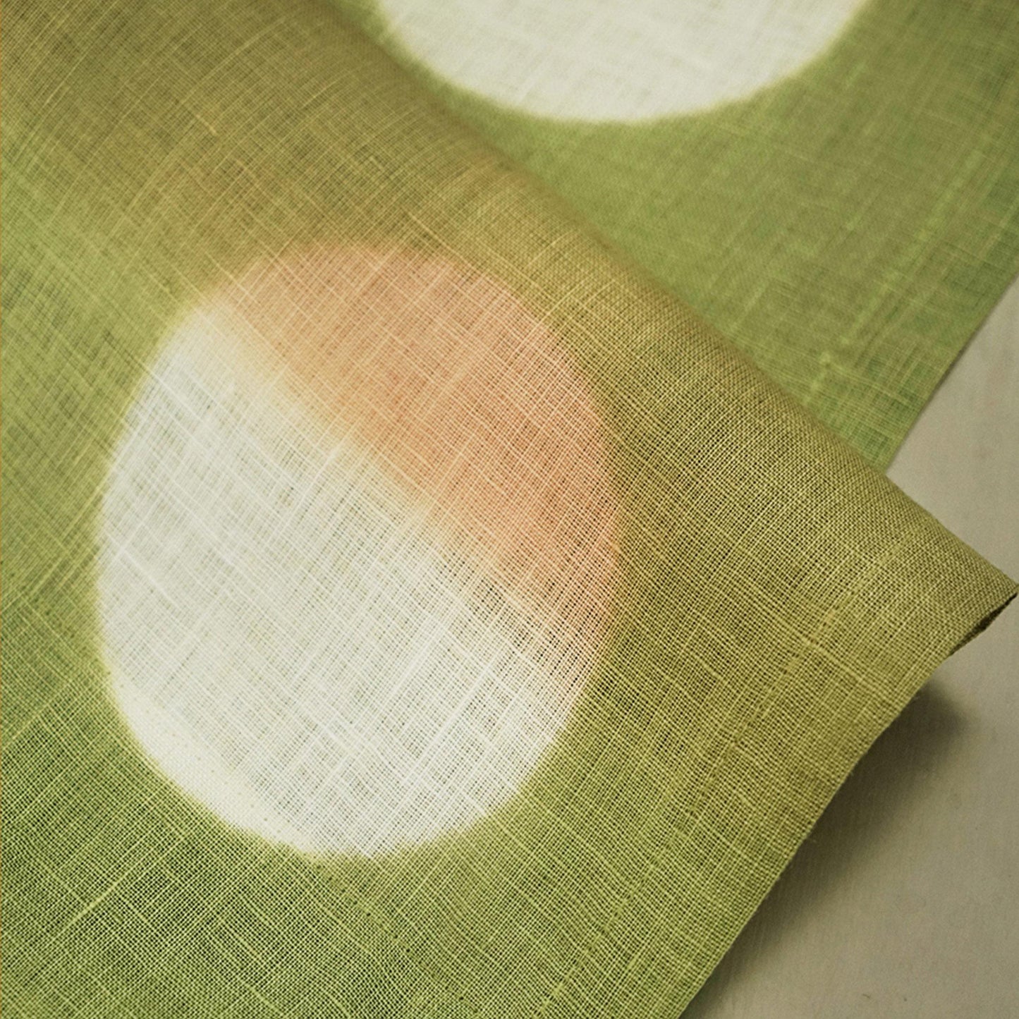 close-up of Polka Dot Linen Noren — Orange / Yellow showing the natural resist-dye motif on linen