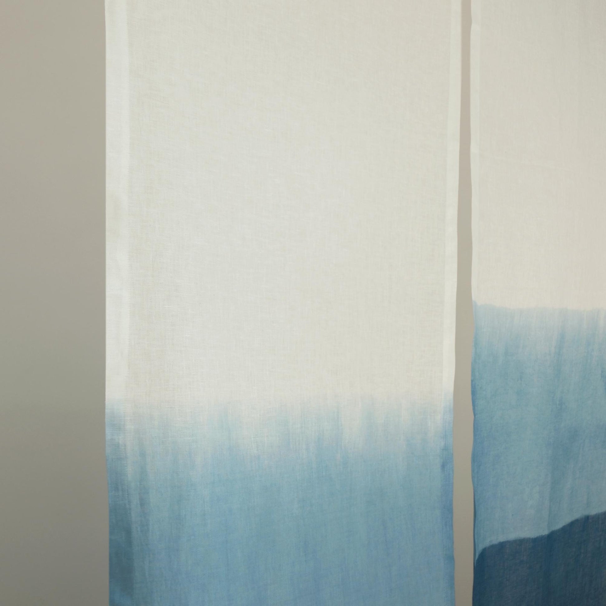 close-up of Soft Tone Noren — Mist Blue showing the natural resist-dye motif on linen