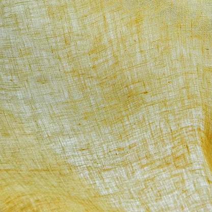 Linen Panel — Citron Yellow hanging by a window, filtering daylight in a styled interior