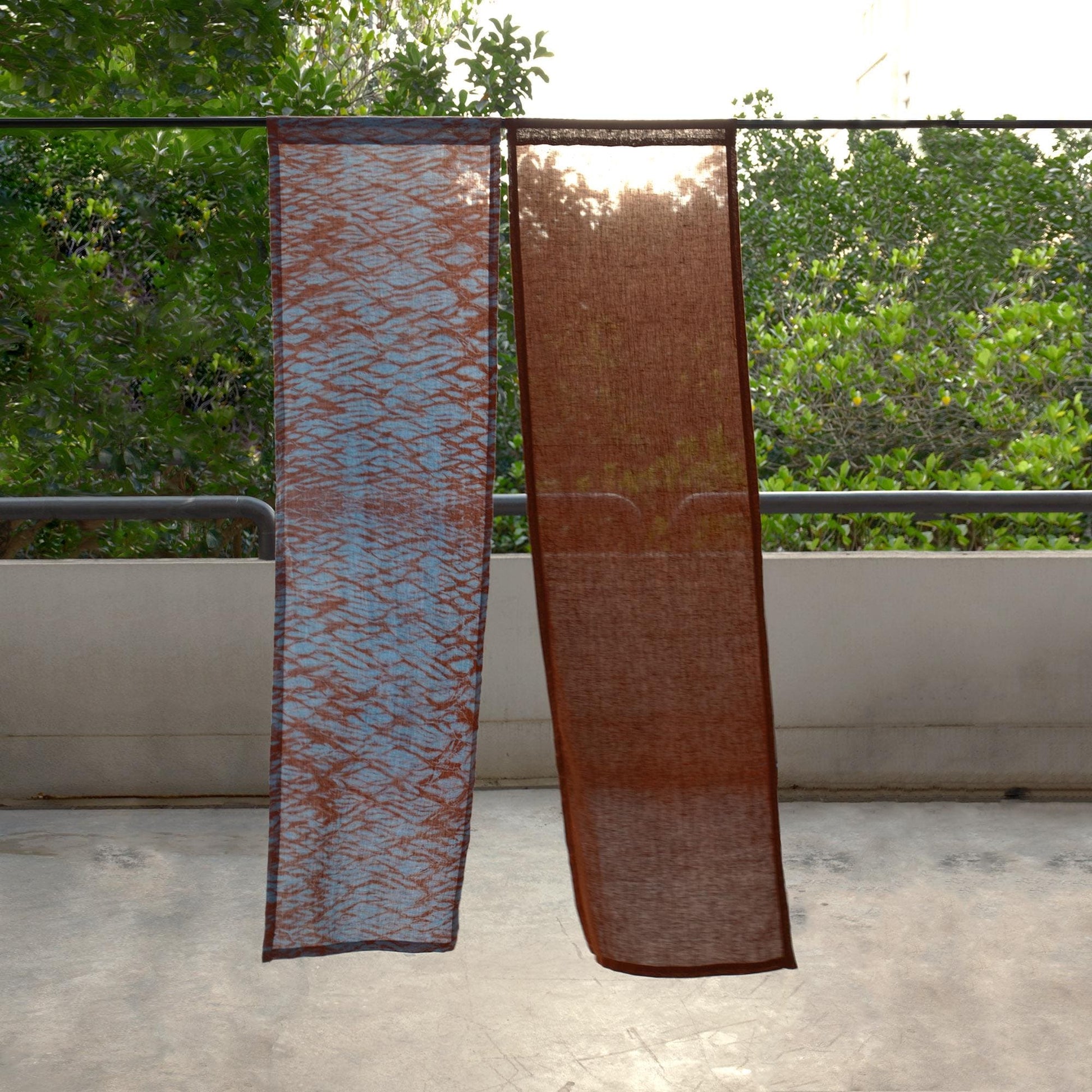 detail view of Motif Linen Noren — Mist Red showing plant-dyed linen texture and pattern