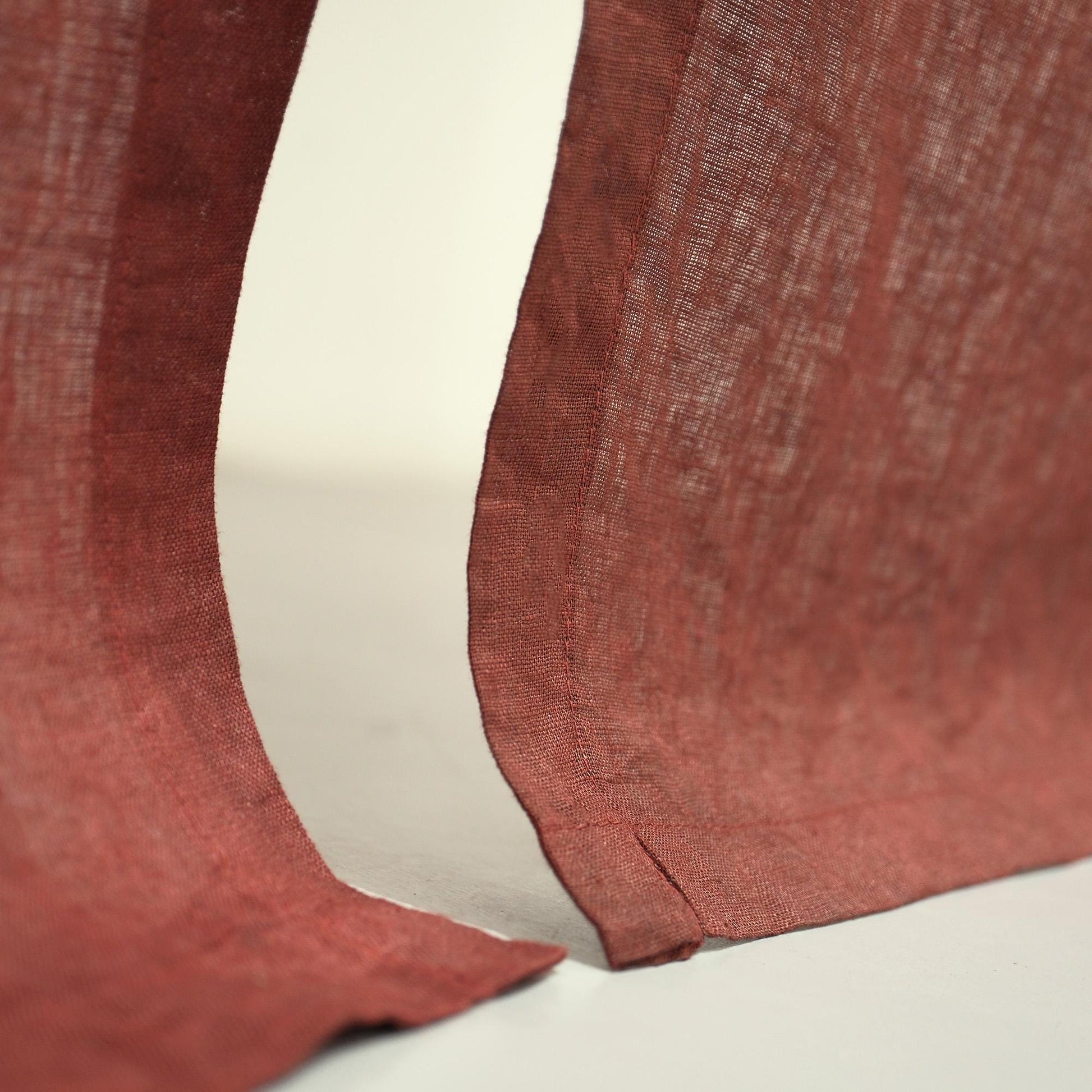 detail view of Soft Tone Noren — Dusty Rose showing plant-dyed linen texture and pattern