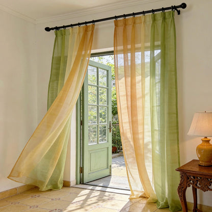 Sheer Curtain — Orange Green hung as window curtains in a bright room