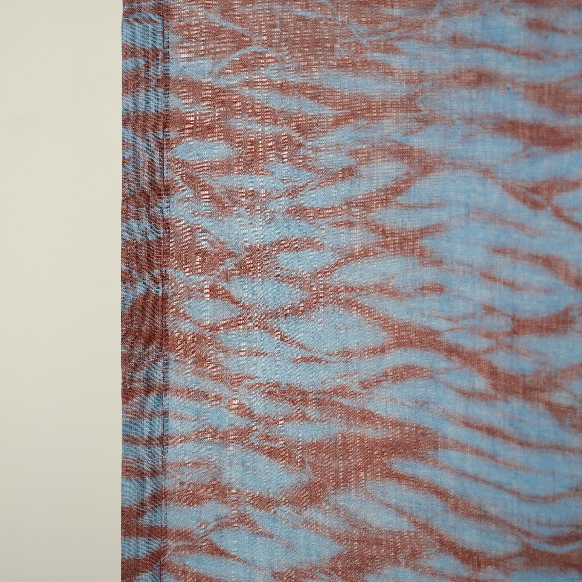 styled room scene with Motif Linen Noren — Mist Red used as a window or doorway curtain